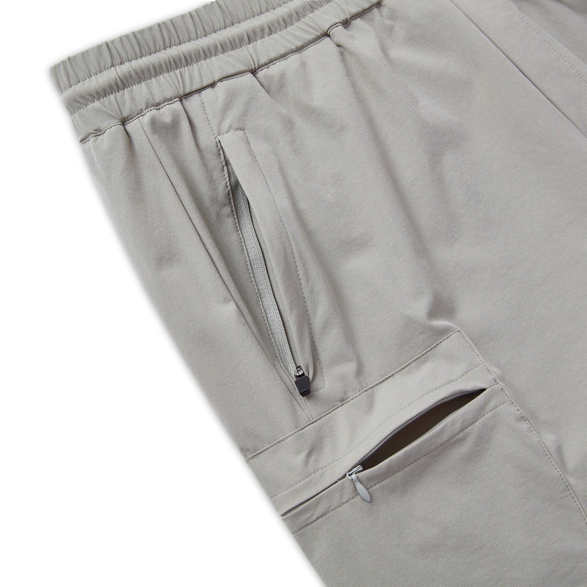 Close-up of gray shorts with zippers on a white background