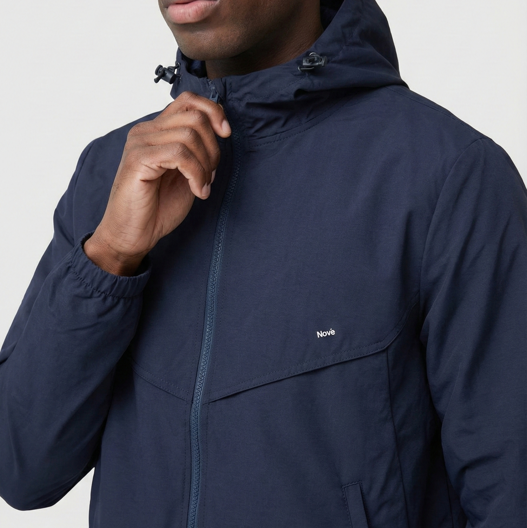 Navy blue jacket with a brand logo on a white background