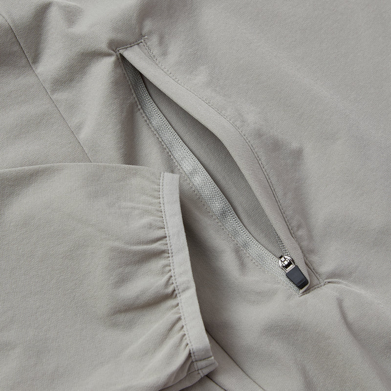 Close-up of a gray jacket with a zipper