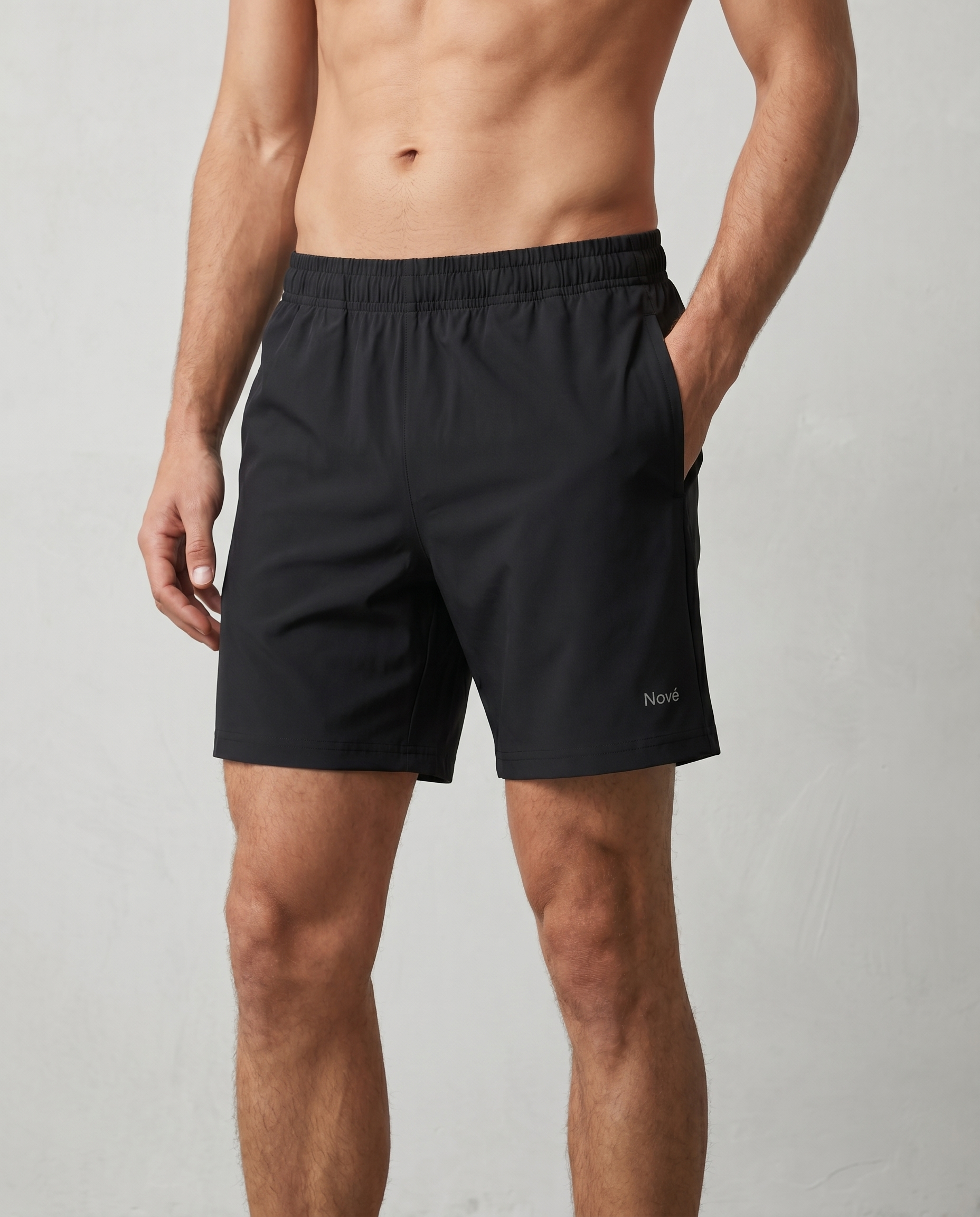model wearing black shorts on a white background
